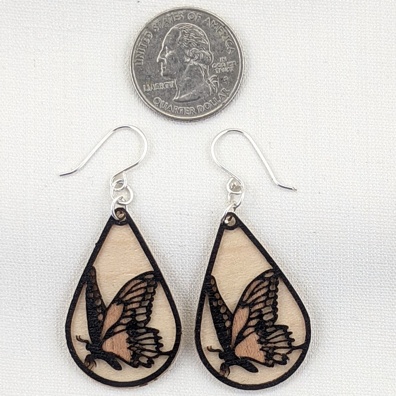 Butterfly earrings, black, cherry and maple, size compared to US Quarter